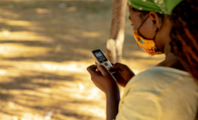 A young woman saves helpline numbers on her cell phone in Mozambique. Photo: UNFPA Mozambique / Mbuto Machili