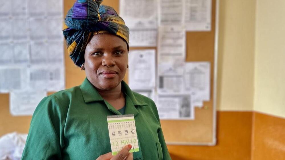 Ana Macuenda, HIV/AIDS counselor at Lichinga Health Centre showcases an HIV test, a daily routine sexual and reproductive health